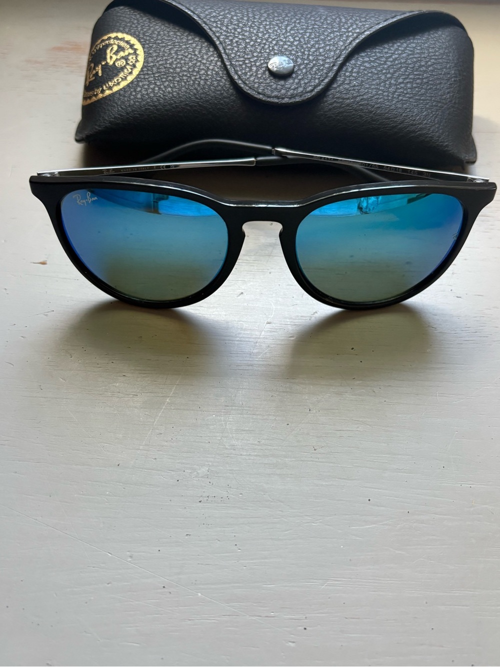 Ray-Ban women’s Black Frame Sunglasses with Blue Mirror Lenses
